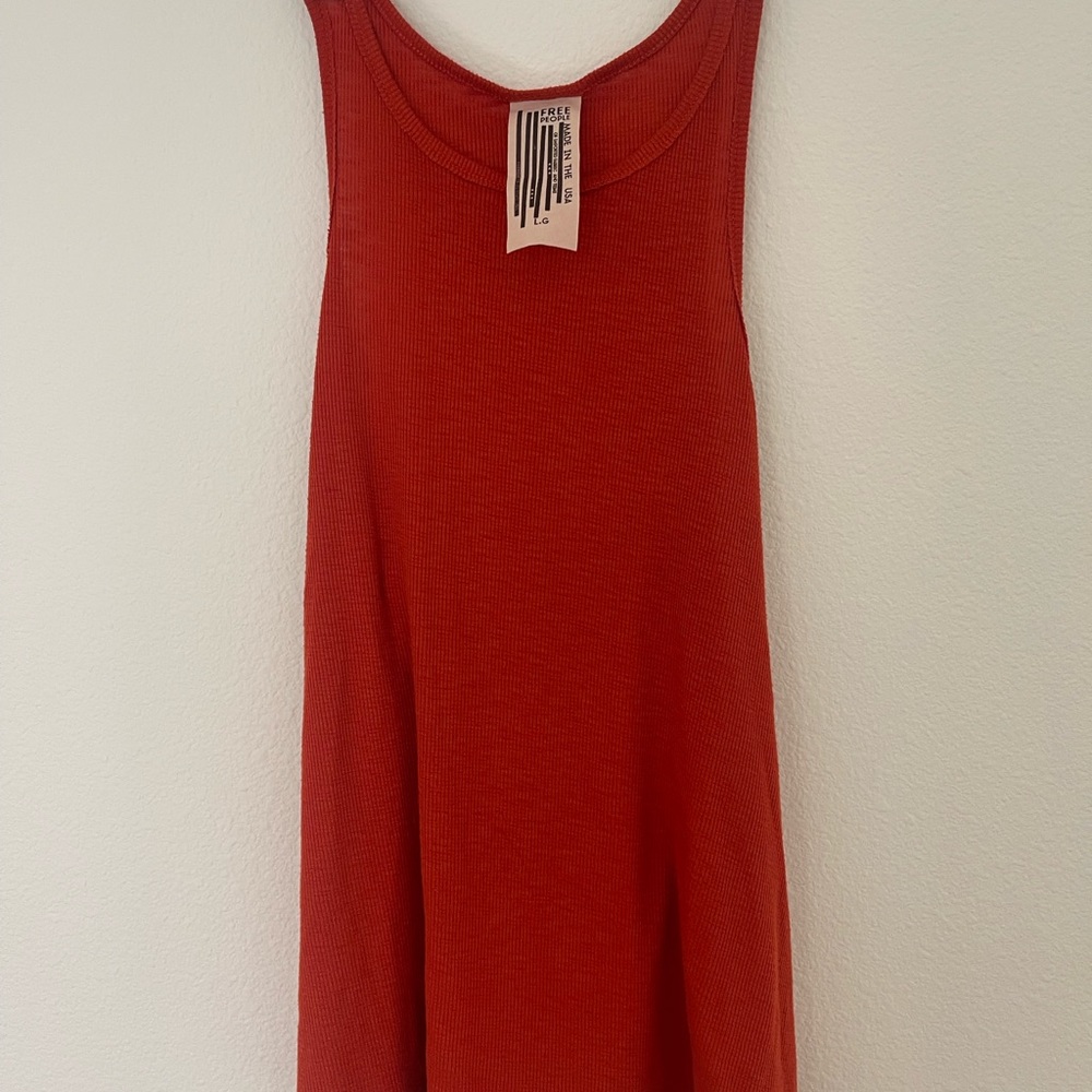 Free people. Orange tank. Size L high neck.